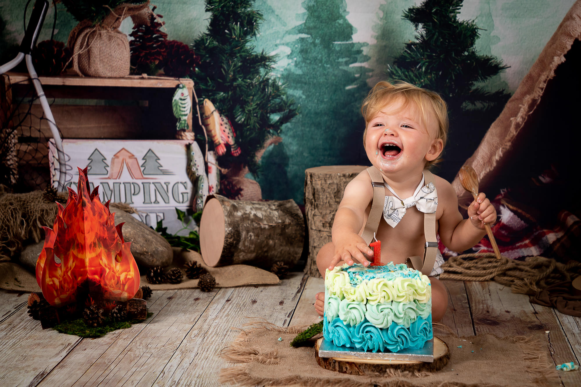 Happy boy laughing at cakesmash shoot
