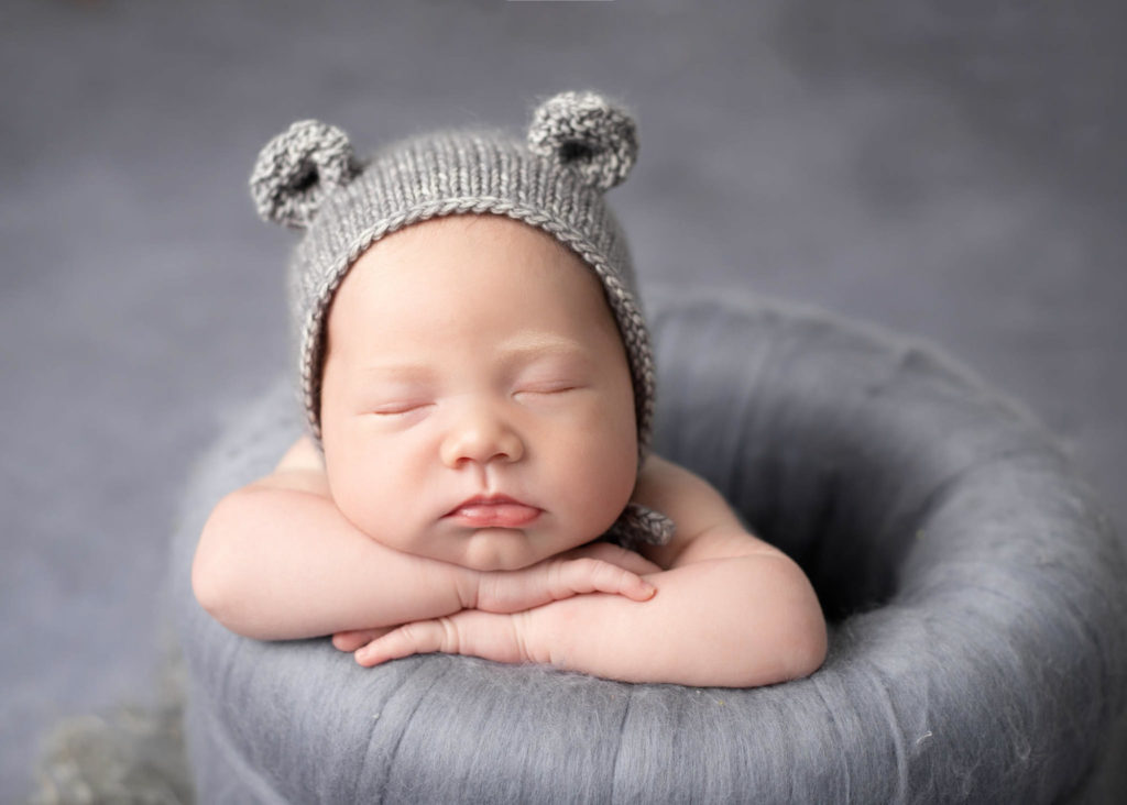 Baby boy posing at Newborn photoshoot Leigh