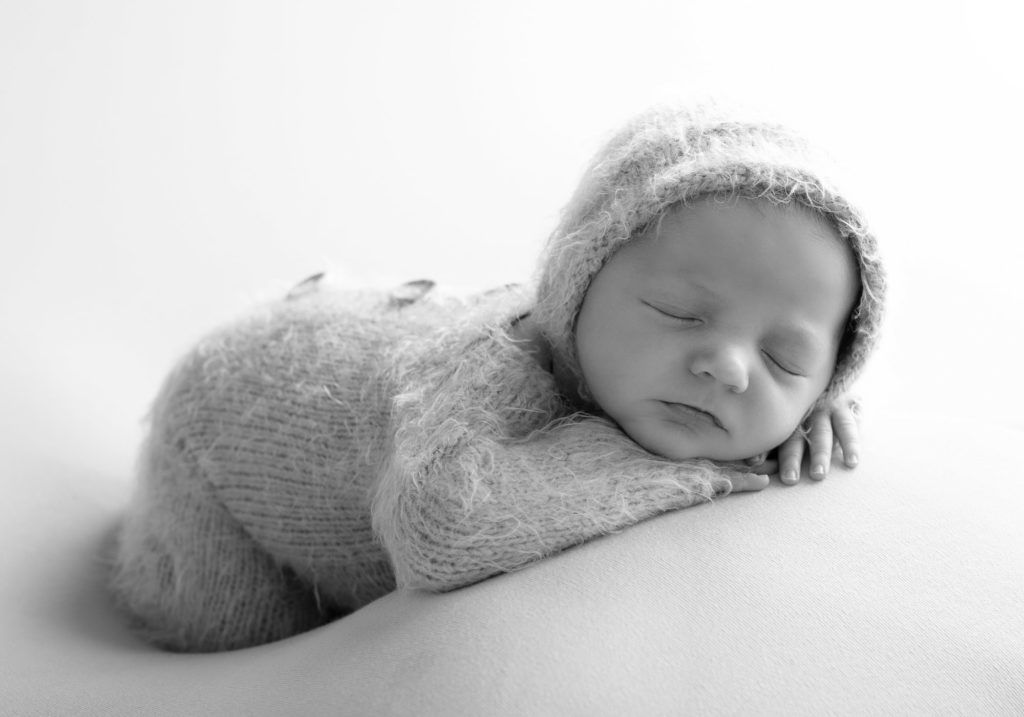 Newborn baby girl at her newborn photography shoot
